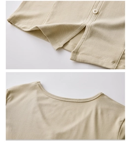 Close-up of light khaki knitted top showing button placket hem and round neckline detail