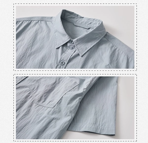 Dettaglio del colletto della camicia e del taschino in grigio-blu con trama fine