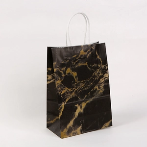 Elegant black kraft paper gift bag with golden marble texture and white rope handles