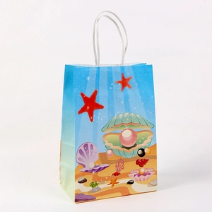 Kraft paper gift bag with blue ocean theme ocean patterns and white rope handle