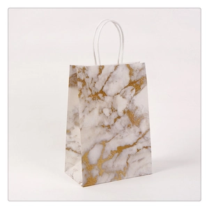 Premium marble pattern paper gift bag with golden cracks and white rope handles