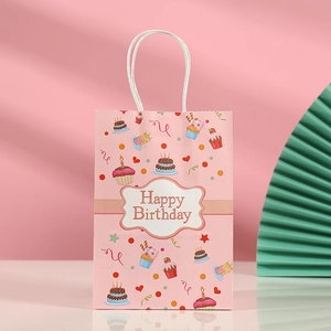 Pink Happy Birthday gift bag with cute cupcake prints and white paper rope handles