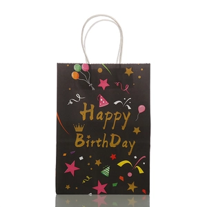 Black paper gift bag with white woven handles and golden Happy Birthday print design