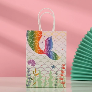 Detail of mermaid kraft paper gift bag with scale pattern and twisted rope handle