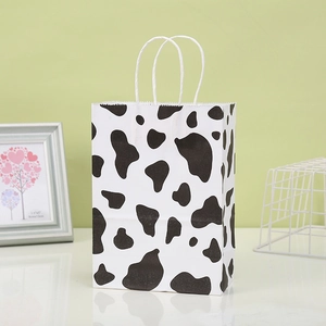 Eco-friendly cow print kraft paper gift bag with white handles for parties and candy