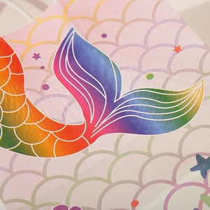 Rainbow mermaid tail kraft paper gift bag with glitter stars and scale pattern