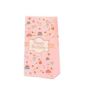 Pink Happy Birthday kraft paper gift bag with colorful cupcake and star patterns