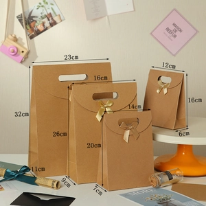Brown kraft gift bags in four sizes with elegant champagne silk bows for packaging