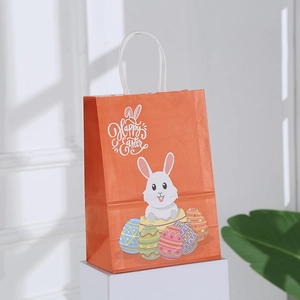 Sacchetto regalo di Pasqua arancione con disegno di coniglio e testo Happy Easter