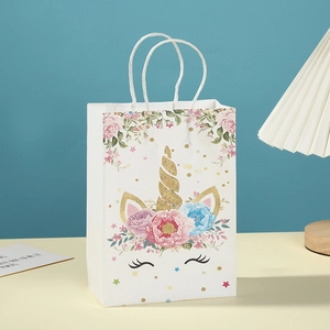 White unicorn kraft paper gift bag with floral prints and glitter horn detail