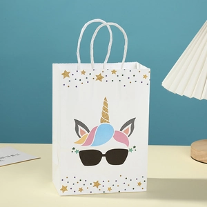 White unicorn paper gift bag with golden glitter horn and stylish rainbow hair design
