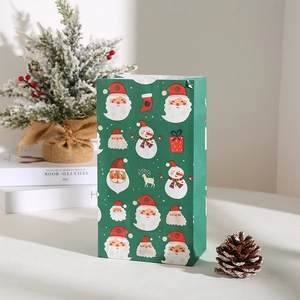 Green Christmas kraft paper gift bag with Santa and snowman patterns for festive packaging