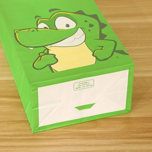 Green kraft paper gift bag with cartoon crocodile print and foldable bottom structure