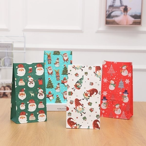 Christmas kraft paper gift bags featuring festive Santa, snowman and reindeer prints set