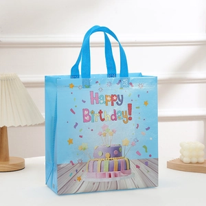 Blue non-woven Birthday gift bag featuring colorful cake print and Happy Birthday text