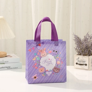 Detail of purple non-woven gift bag with Thank You text and cute cartoon animals