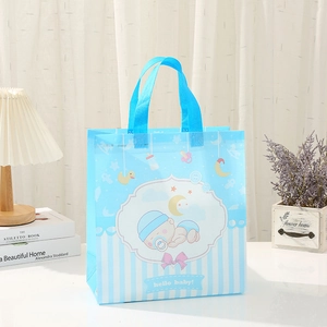 Blue non-woven gift bag with baby prints and hello baby text for birthday packing