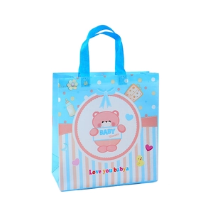 Blue non-woven baby shower gift bag featuring a cute bear print and sturdy handles