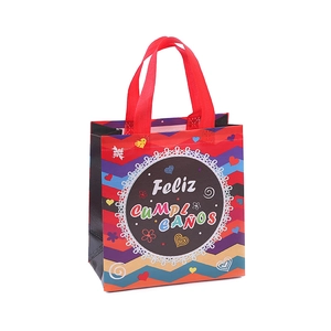 Laminated non-woven birthday gift bag with colorful wave patterns and Feliz Cumpleaños text