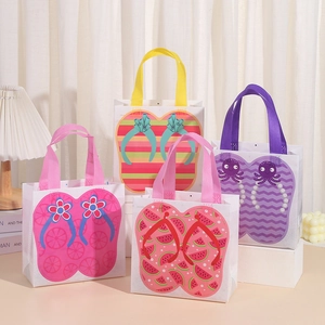 Close-up of four non-woven gift bags with creative flip-flop summer prints and colorful handles