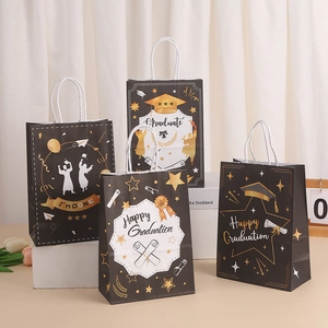 Black and gold graduation paper gift bags with graduation cap patterns and handles