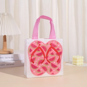 White non-woven gift bag with summer flip-flop print and pink woven handles