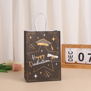Elegant black and gold Happy Graduation paper gift bag with white rope handles for party
