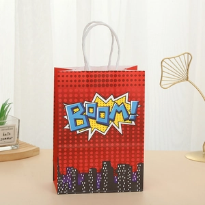 Detail of red pop art gift bag with BOOM! text and white rope handle for party favors