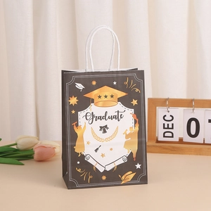 Close-up of black graduation gift bag with gold doctoral cap and white rope handle