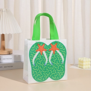 Detail of waterproof non-woven gift bag featuring summer flip-flop and starfish prints