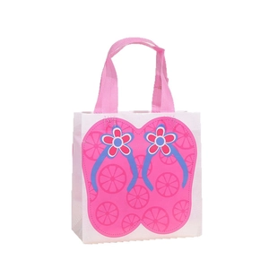 Waterproof non-woven gift bag with summer flip-flop print and pink handles for beach