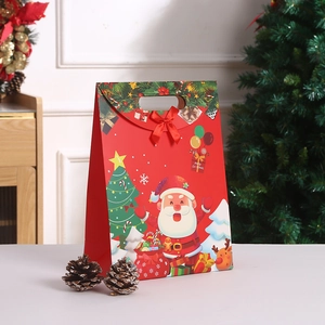 Red Christmas gift bag with Santa and reindeer illustration and a red satin bow