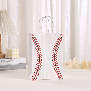 Close-up of white paper gift bag with red baseball stitching print in cozy room