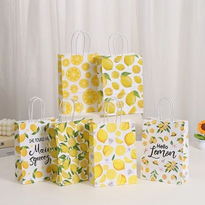 White kraft paper gift bags with yellow lemon patterns and white rope handles