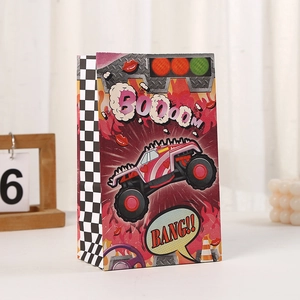 Detail view of paper gift bags with monster truck and racing theme for car party supplies
