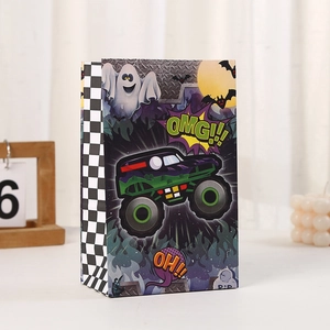 Close-up of Halloween paper gift bag with green monster truck and ghost print