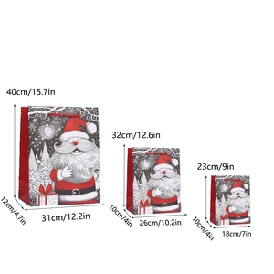 Three sizes of Santa Claus gift bags with red rope handles on a white background
