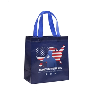 Blue non-woven Veterans Day gift bag with stars and stripes map and soldier silhouette