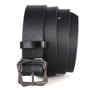 Detail of black lychee grain leather belt with unique geometric gunmetal buckle