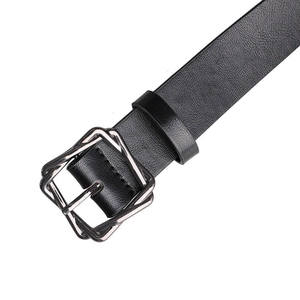Detail of black textured leather belt with silver double square geometric metal buckle