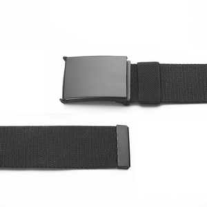Detail of the black tactical nylon belt featuring a smooth matte metal buckle and metal tip