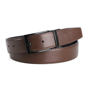 Detail of classic men's business belt with black matte pin buckle and brown leather texture