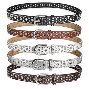 Close-up of five-piece punk style rhinestone studded belts with silver buckles