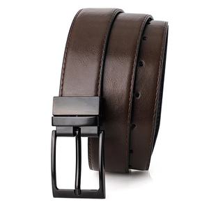 Detail of dark brown leather belt with matte black buckle and fine stitching