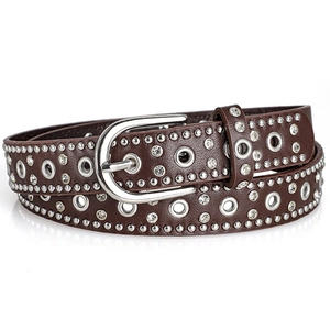 Close-up of brown punk leather belt with silver rivets and sparkling rhinestones