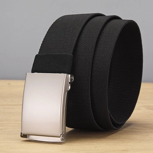 Detail of black elastic woven belt with matte silver buckle on a wooden surface