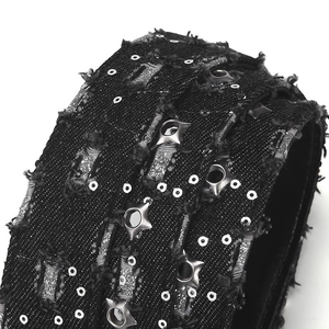 Close-up of black punk fabric belt with star rivets and distressed frayed edges