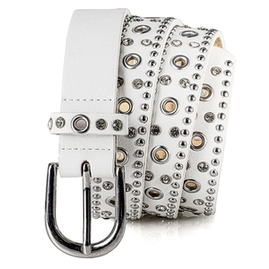 Close-up of white punk belt with silver eyelets and rhinestones on a polished metal buckle