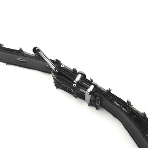 Detail of punk style belt featuring black leather with distressed denim edges and metal ring