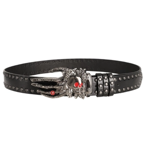 Close-up of punk skull buckle belt with red eye accents and metal rivets decoration